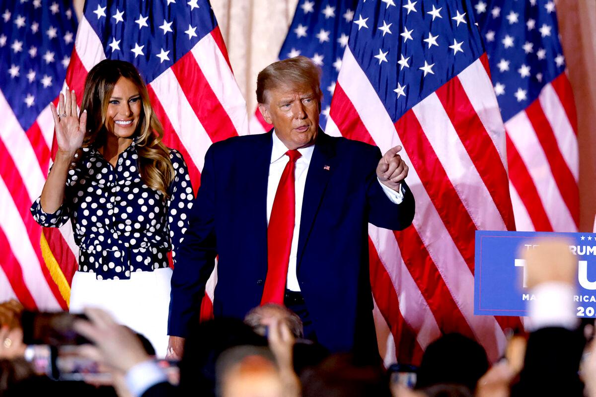 Former President Donald Trump, joined by former First Lady Melania Trump, arrives to speak at the Mar-a-Lago Club in Palm Beach, Fla., on Nov. 15, 2022. (Alon Skuy/AFP via Getty Images)