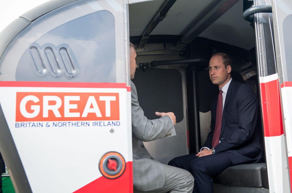 Britain's Prince William (R), the Duke of Cambridge is shown a driverless vehicle as he visits Milton Keynes to celebrate the 50th anniversary of the city on Sept. 26, 2017. (Chris J Ratcliffe/AFP via Getty Images)