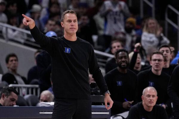 Duke head coach Jon Scheyer signals to his players during the second half of an NCAA college basketball game against Kansas, in Indianapolis on Nov. 15, 2022. (Darron Cummings/AP Photo)