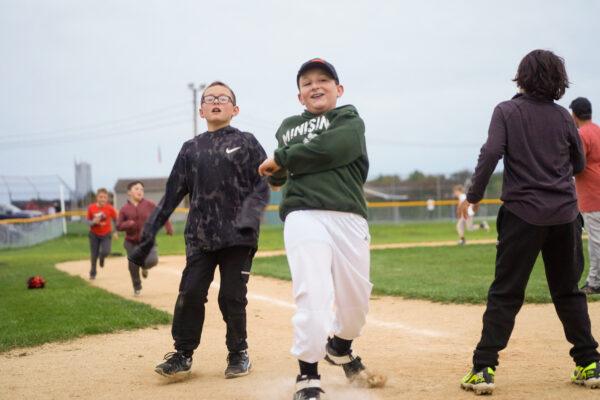 Otisville Little League members practice running at a field in Otisville, N.Y., on Sept. 30, 2022. (Cara Ding/The Epoch Times)