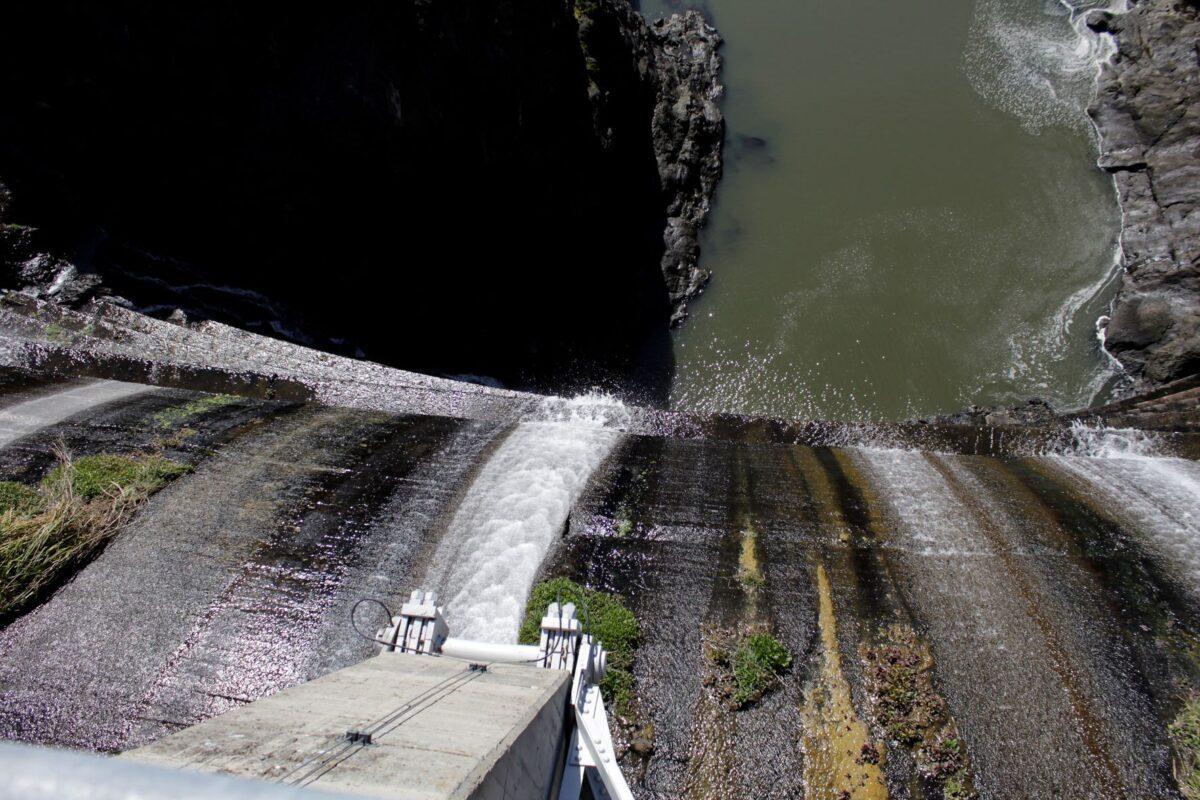 Excess water spills over the top of a dam on the Lower Klamath River known as Copco 1 near Hornbrook, Calif., on March 3, 2020. (Gillian Flaccus/AP Photo)