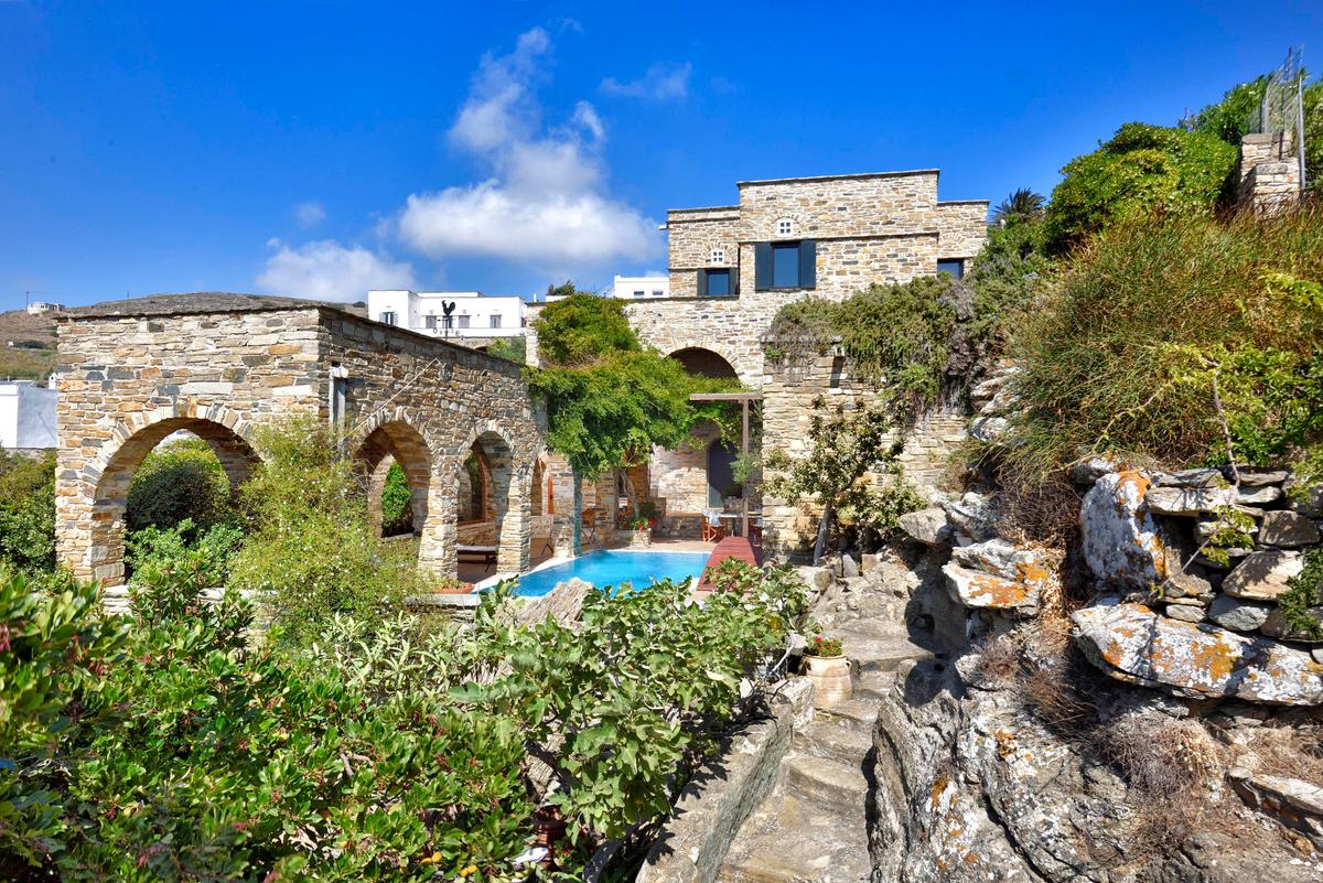 The buildings on the property were hand-crafted by artisans using native stone, and fit perfectly in a setting that embraces nature. (Courtesy of Greece Sotheby’s International Realty)