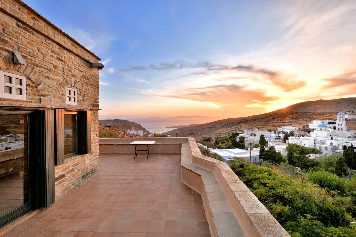 The property’s broad terraces provide the owners and their guests a commanding view of the nearby town and hillsides, with the Aegean Sea as a backdrop. (Courtesy of Greece Sotheby’s International Realty)