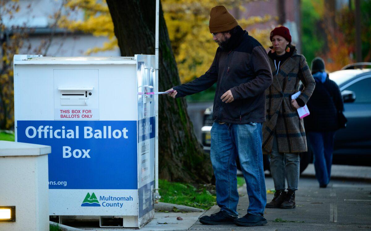 A voter casts a ballot at an official ballot box in Portland, Ore., on Nov. 8, 2022. (Mathieu Lewis-Rolland/Getty Images)