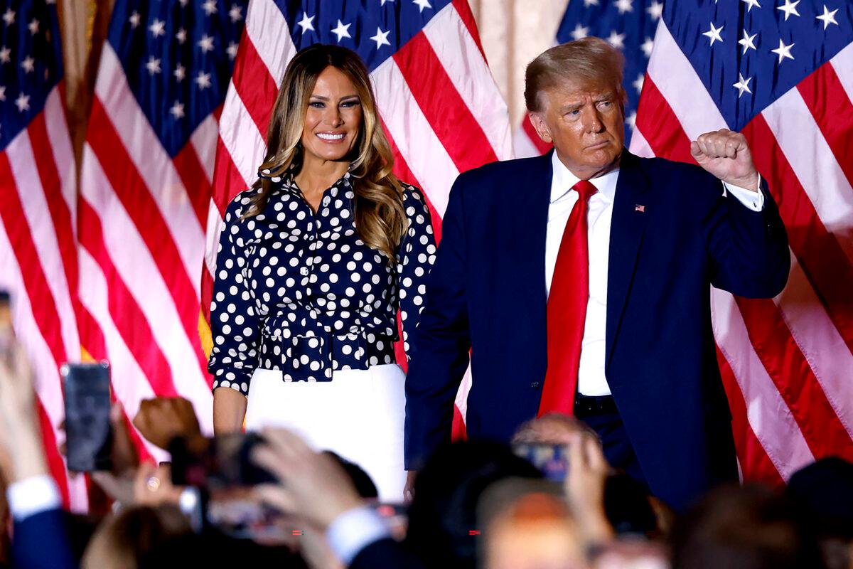 Former U.S. President Donald Trump, joined by former First Lady Melania Trump, arrives to speak at the Mar-a-Lago Club in Palm Beach, Fla., on Nov. 15, 2022. (Alon Skuy/AFP via Getty Images)