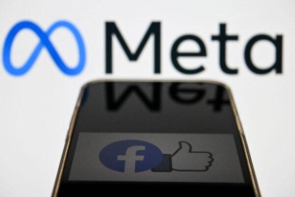 The Meta logo, and Facebook's logo, on a smartphone screen. (Kirill Kudryavtsev/AFP via Getty Images)
