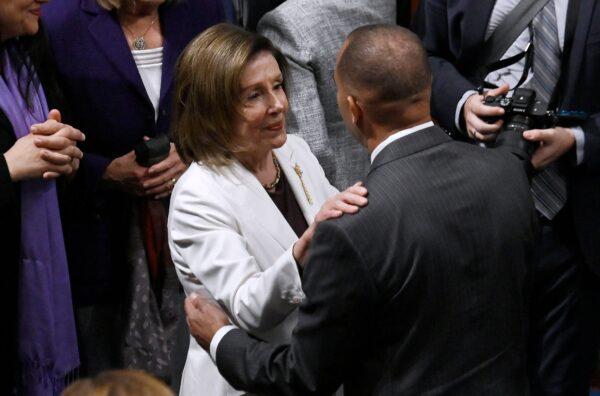 House Speaker Nancy Pelosi (D-Calif.), left, listens to House Democratic Caucus Chair Rep. Hakeem Jeffries (D-N.Y.) in Washington on Nov. 17, 2022. (Olivier Douliery/AFP via Getty Images)