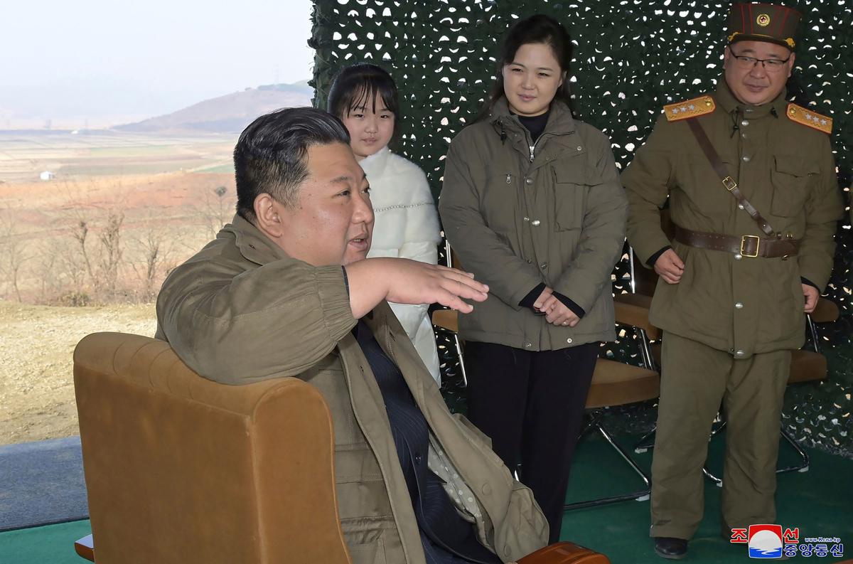 Kim Jong-un accompanied by his wife Ri Sol-ju (2nd R) and his daughter, as Kim inspects the test firing of what it says was a Hwasong-17 intercontinental ballistic missile, at Pyongyang International Airport in Pyongyang, North Korea, on Nov. 18, 2022, in a photo provided by the North Korean regime on Nov. 19, 2022. (Korean Central News Agency/Korea News Service via AP)