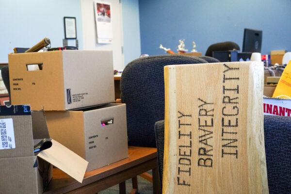 Boxes of personal belongings of Orange County Sheriff Carl DuBois in his office in Goshen, N.Y., on Nov. 19, 2022. (Cara Ding/The Epoch Times)
