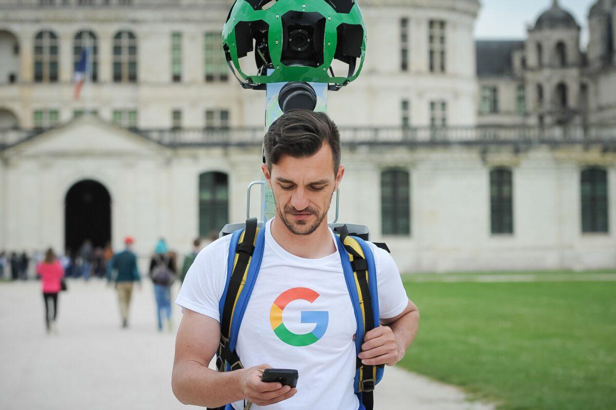 A picture taken on May 17, 2016, shows a Google Tracker Man walking inside the Chambord Castle and taking panoramic pictures for the Google map and Google Street in Chambord, France. (Guillaume Souvant/AFP via Getty Images)