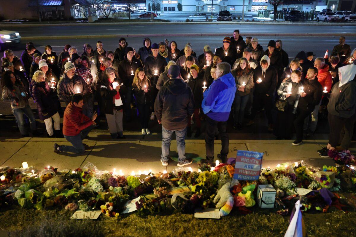 : People hold a vigil at a makeshift memorial near the Club Q nightclub in Colorado Springs, Colo., on Nov. 20, 2022. (Scott Olson/Getty Images)