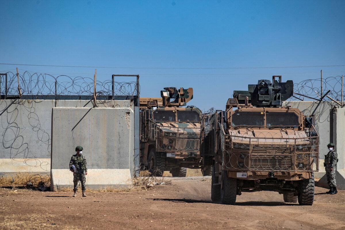 Turkish military vehicles enter Syria to take part in a joint patrol with Russian troops, in the countryside of the town of Derbassiye in Syria's Hasakeh Province, on the border with Turkey on July 14, 2021. (Delil Souleiman/AFP via Getty Images)