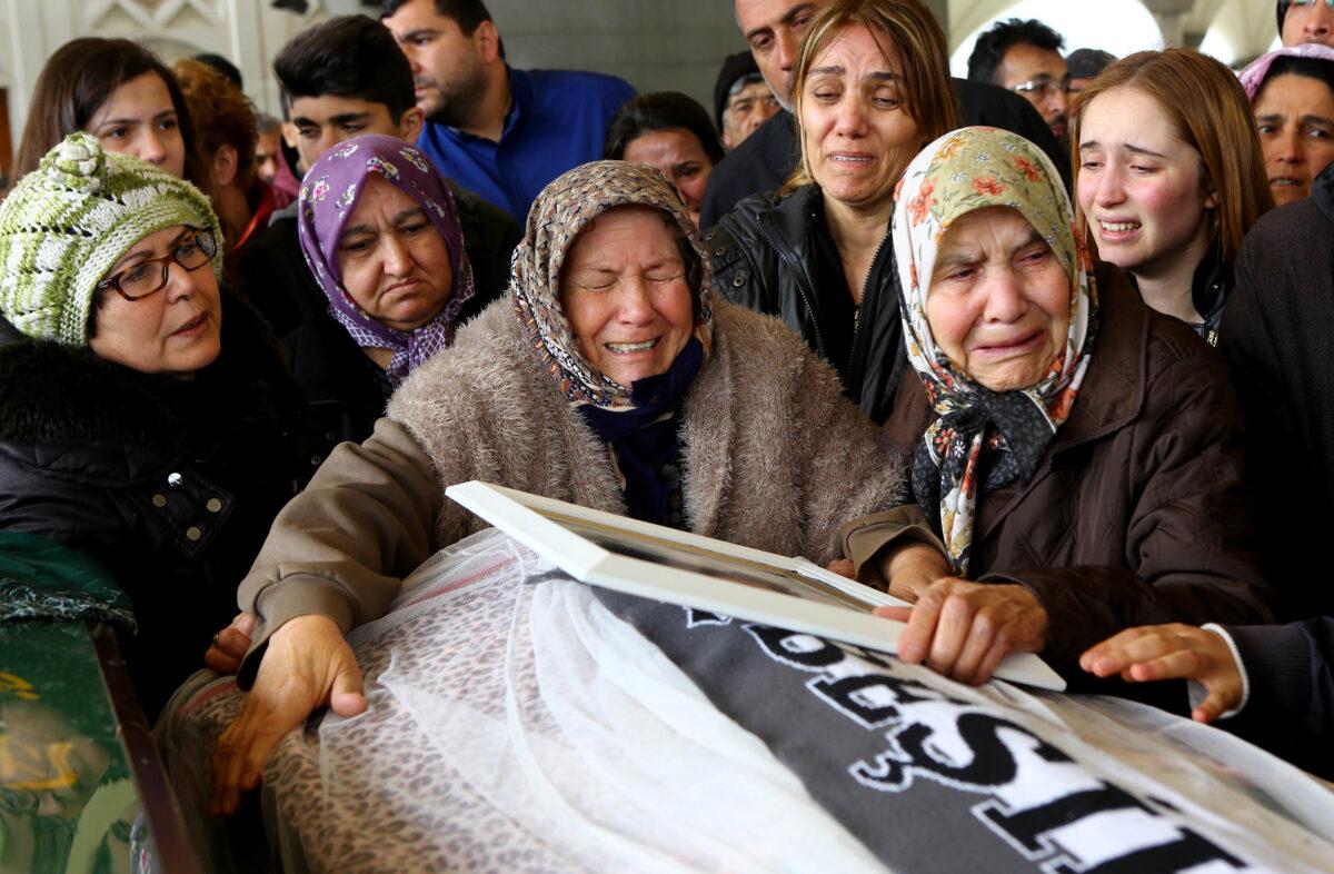 Relatives mourn a victim of a 2016 suicide bomb attack in Ankara, Turkey, on March 13, 2016, that killed 36 people. In response, Turkish warplanes pounded Kurdish rebel bases in northern Iraq. (Adem Altan/AFP via Getty Images)