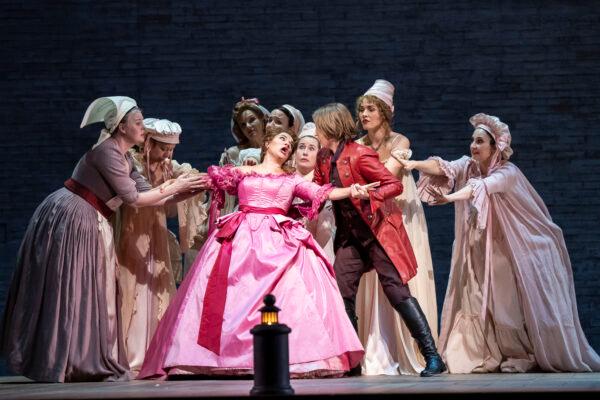 Countess Adèle (Kathryn Lewek in pink) and Isolier (Kayleigh Decker in red), in The Lyric Opera of Chicago's production of "Le Comte Ory." (Todd Rosenberg)