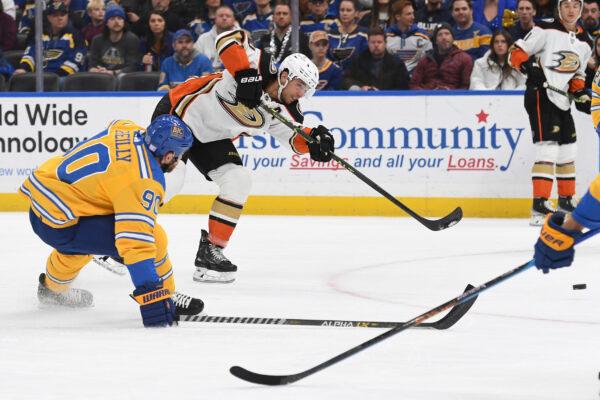 Anaheim Ducks' Cam Fowler shoots the puck against the St. Louis Blues during the first period of an NHL hockey game in St. Louis, on Nov. 21, 2022. (Michael Thomas/AP Photo)