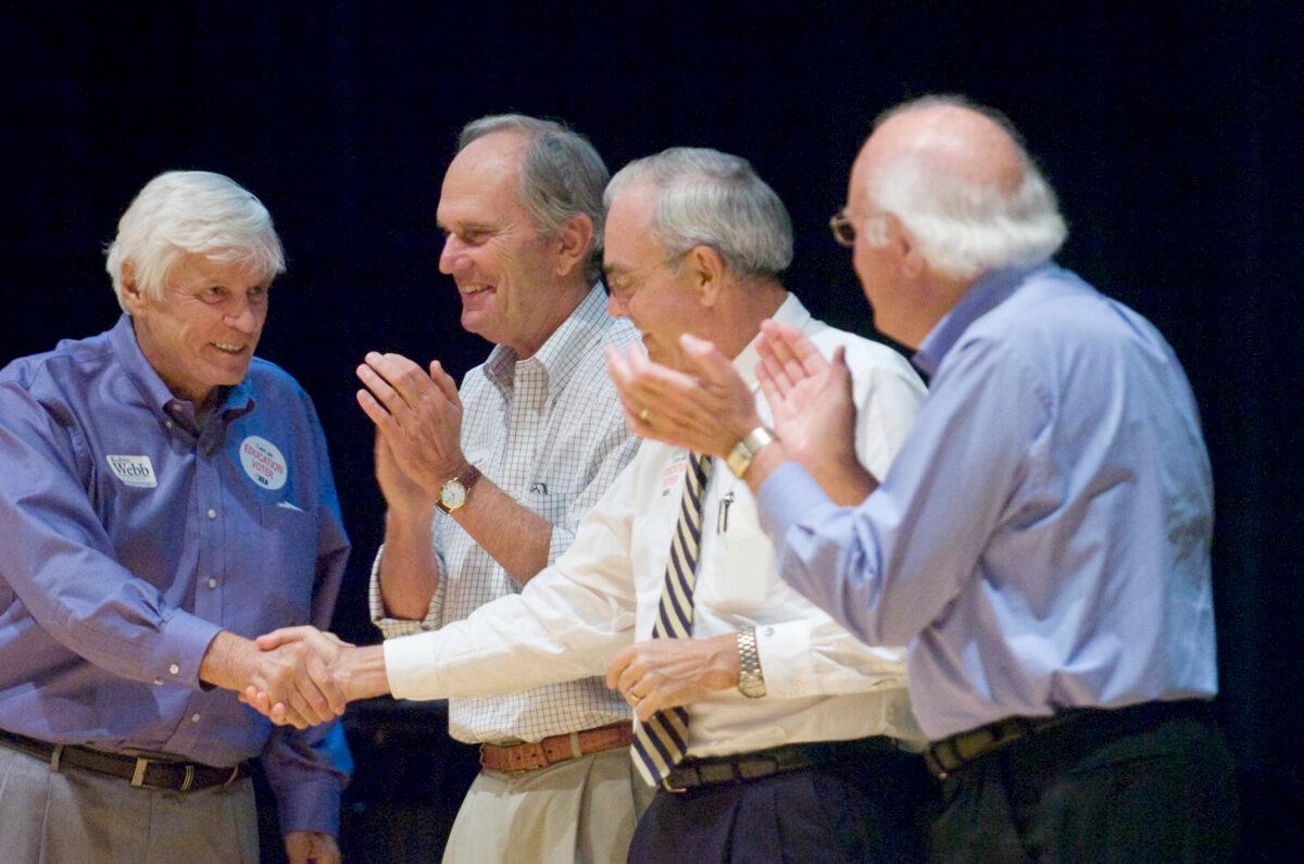 Former Kentucky Gov. John Y. Brown (L), shakes hands with fellow former Gov. Paul Patton, as two other former state chief executives, Brereton Jones and Julian Carroll look on in Raceland, Ky., on Aug. 22, 2009. (John Flavell/The Daily Independent via AP)