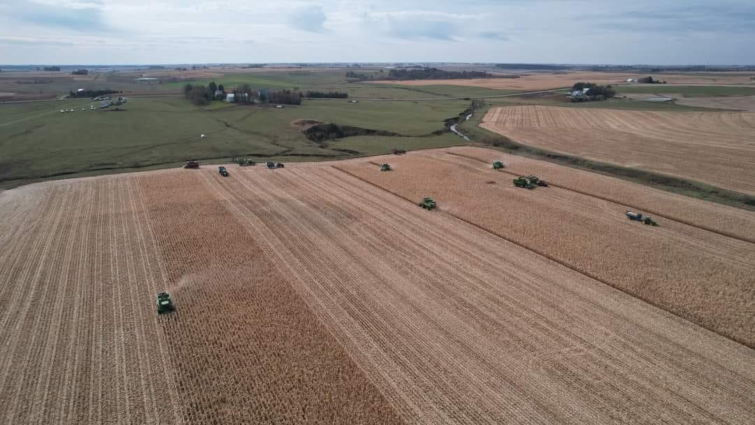 An aerial view of farmers cooperating to harvest Paul Baker's corn crop after he died of cancer. (Courtesy of Melissa Baker)