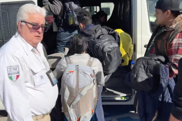 A Mexican immigration official waits as migrants with U.S.-approved parole authority load into his van ready to cross into the United States via a port of entry. (Courtesy of Todd Bensman/Center for Immigration Studies)