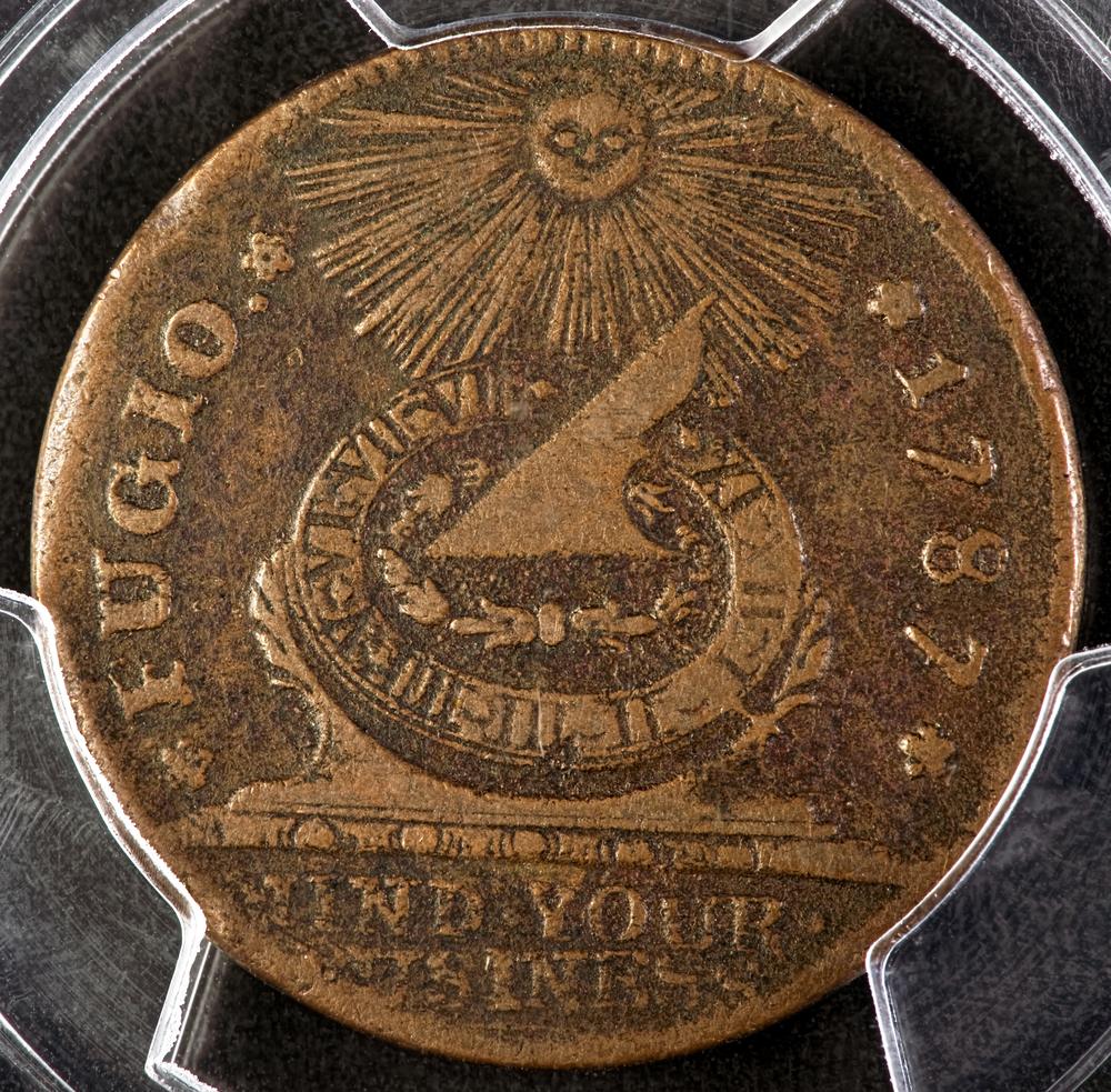 The Fugio cent, which depicts the images of 13 interlocking rings on one side and a sun and sundial on the other, was designed by Benjamin Franklin as the first official coin in circulation in the United States. (W. Scott McGill/Shutterstock)