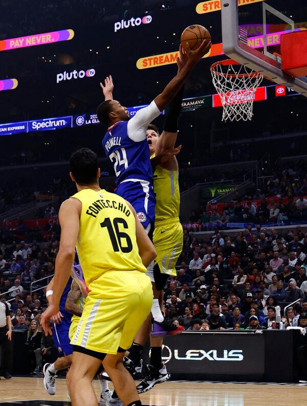 Norman Powell (24) of the LA Clippers is fouled by Walker Kessler (24) of the Utah Jazz in the first half at Crypto.com Arena in Los Angeles on Nov. 21, 2022. (Ronald Martinez/Getty Images)