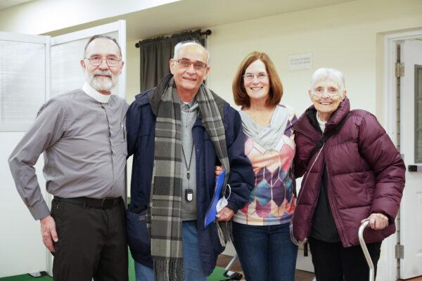 Rector Victor Sarrazin (L), Pastor Peter Rustico (2nd L), Michele Duggan (2nd R), and Marilyn Pierce (R) at Middletown Warming Station in Middletown, N.Y., on Nov. 20, 2022. (Cara Ding/The Epoch Times)