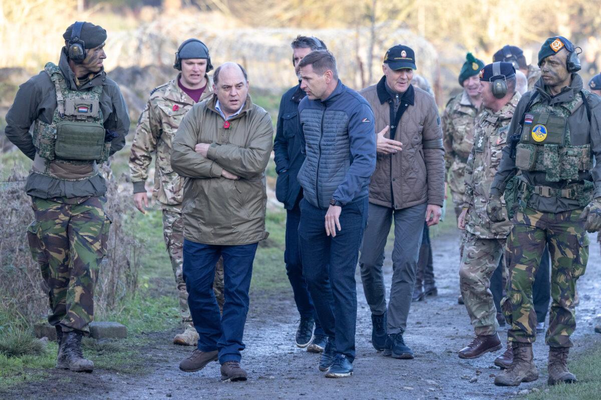 Ben Wallace, secretary of state for defence of the United Kingdom, observes as Ukrainian soldiers take part in a military exercise in the north of England, United Kingdom, on Nov. 9, 2022. (Andy Commins - Pool/Getty Images)
