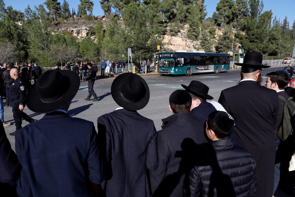 Jewish men at the scene of an explosion at a bus stop in Jerusalem, Israel, on Nov. 23, 2022. (Ammar Awad/Reuters)