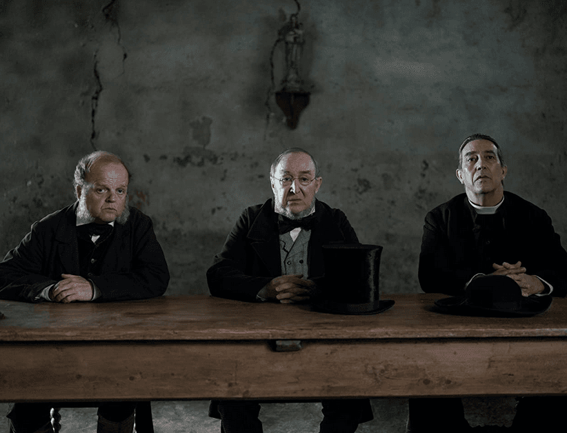 (L–R) Village elders Dr. McBrearty (Toby Jones), Sir Otway (Dermot Crowley), and Father Thaddeus (Ciarán Hinds), in "The Wonder." (Element Pictures/Netflix)