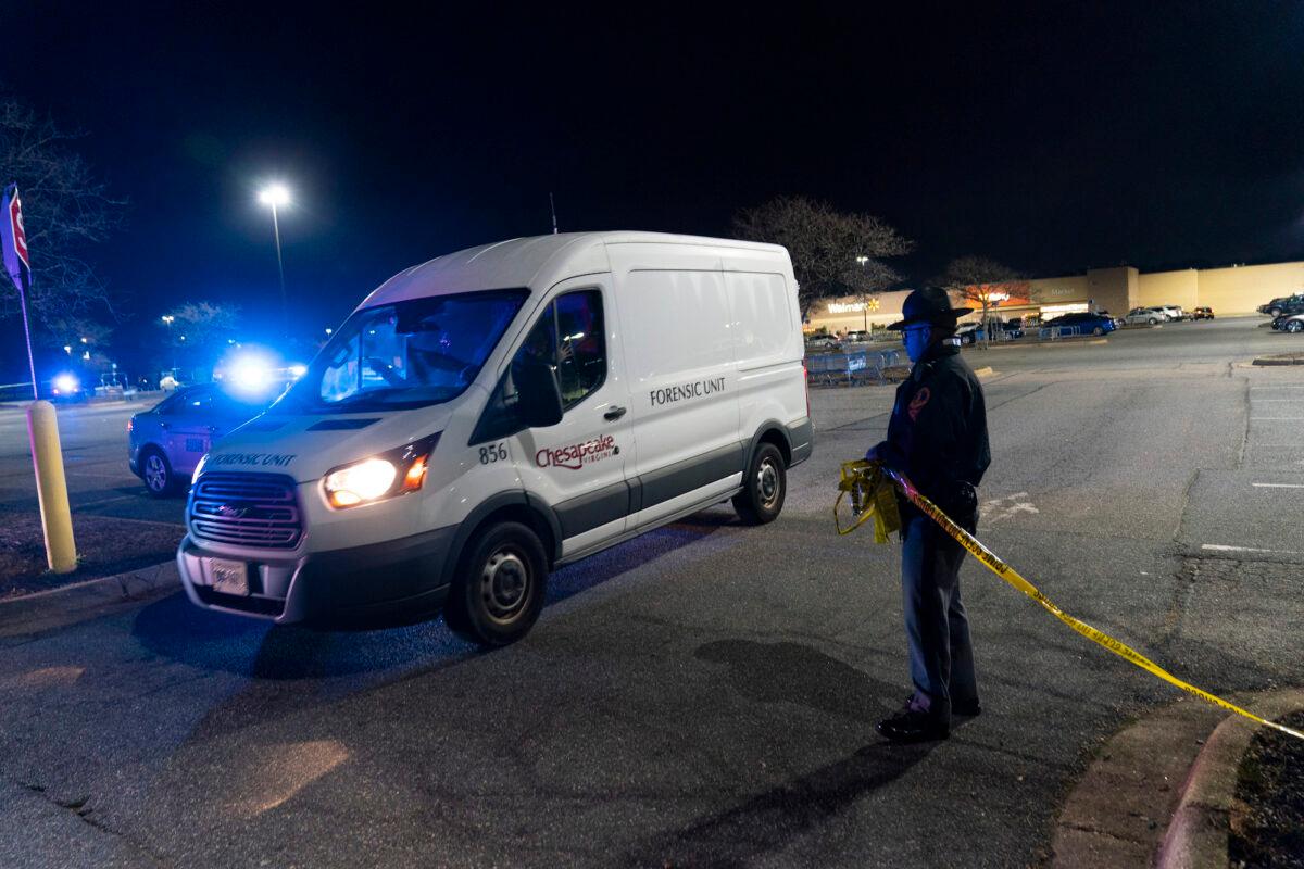 A forensics van leaves as law enforcement work at the scene of a mass shooting at a Walmart, in Chesapeake, Va., on Nov. 23, 2022. (Alex Brandon/AP Photo)