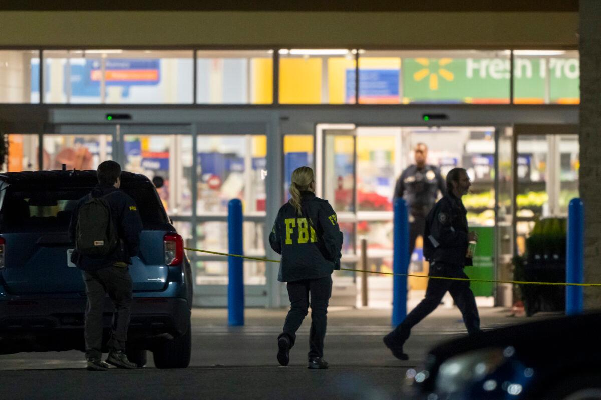 Law enforcement, including the FBI, work the scene of a mass shooting at a Walmart in Chesapeake, Va., on Nov. 23, 2022. (Alex Brandon/AP Photo)