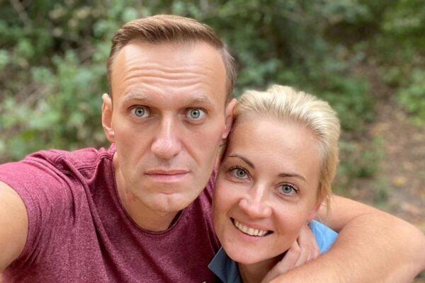 Russian dissident Alexei Navalny (shown here with his wife) researched who was responsible for his poisoning, in "Navalny." (HBO Max)