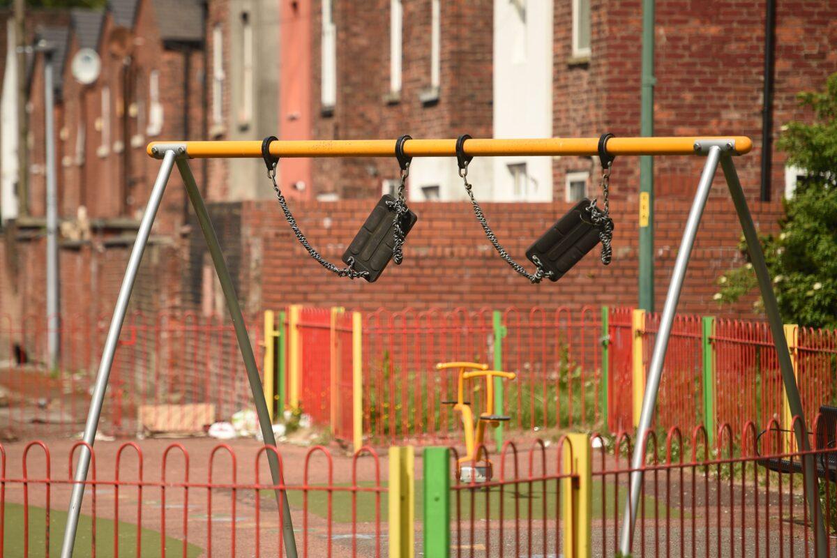 Seats of a swing are seen tied up to prevent use during the first national COVID-19 lockdown in a playground in Manchester, north-west England, on May 11, 2020. (Oli Scarff/AFP via Getty Images)