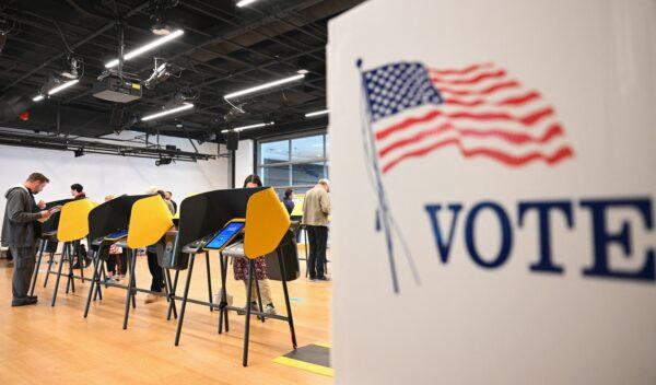 People cast ballots on electronic voting machines for the midterm election during early voting ahead of Election Day inside a vote center at the Hammer Museum in Los Angeles on Nov. 7, 2022. (Patrick T. Fallon/AFP via Getty Images)