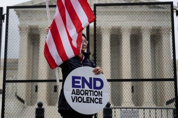A pro-life demonstrator stands in front of the U.S. Supreme Court on May 5, 2022, about six weeks before the court issued its ruling repealing the federally protected right to abortion. (Jim Watson/AFP via Getty Images)