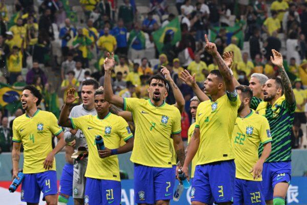 Brazil players celebrate after they won the Qatar 2022 World Cup Group G football match between Brazil and Serbia at the Lusail Stadium in Lusail, in Lusail City, Qatar, on Nov. 24, 2022. (Nelson Almeida/AFP via Getty Images)
