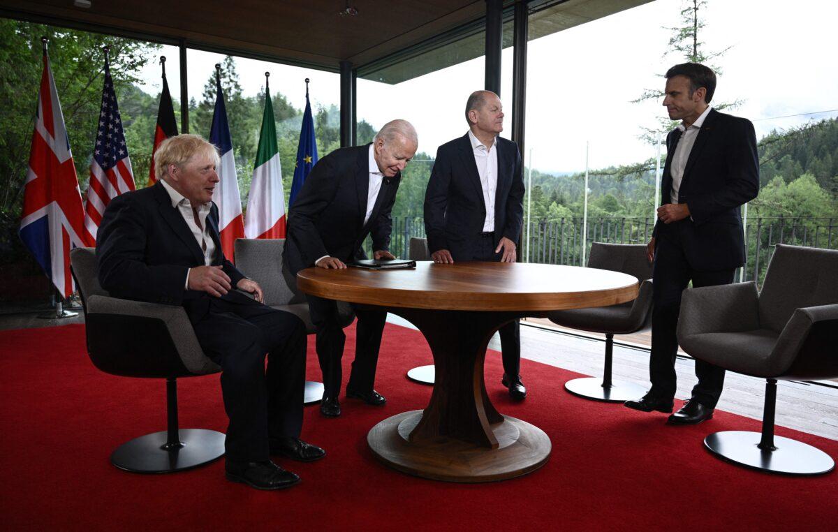 (L-R) British Prime Minister Boris Johnson, U.S. President Joe Biden, German Chancellor Olaf Scholz, and French President Emmanuel Macron take their seats prior to a meeting of five G7 leaders, at southern Germany's Elma Castle, on June 28, 2022. (Brendan Smialowski/AFP via Getty Images)