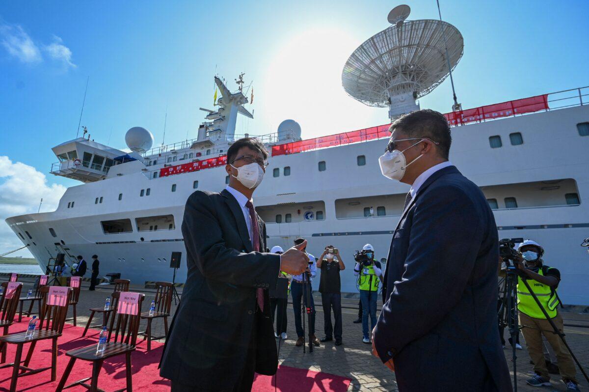 Chinese Ambassador to Sri Lanka Qi Zhenhong (Left) gestures upon the arrival of the Chinese research and survey vessel, the Yuan Wang 5, at Sri Lanka's Hambantota port on Aug. 16, 2022. (Ishara S. Kodikara/AFP via Getty Images)
