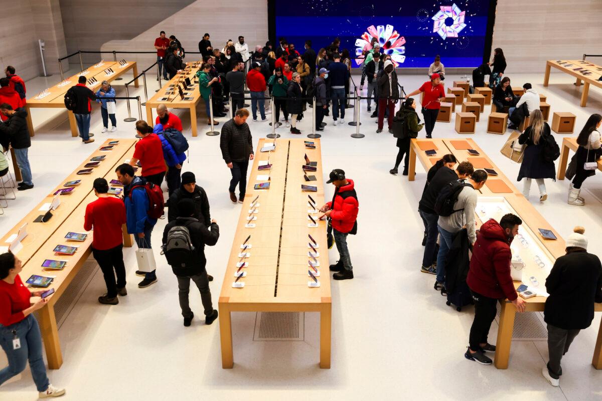 Customers shop in an Apple store on Black Friday in New York on Nov. 25, 2022. (Julia Nikhinson/AP Photo)