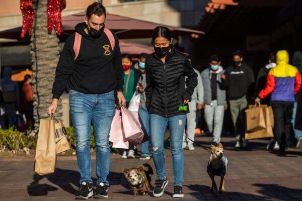 Shoppers walk around Citadel Outlets in City of Commerce, Calif., on Nov. 26, 2021. (Apu Gomes/AFP via Getty Images)