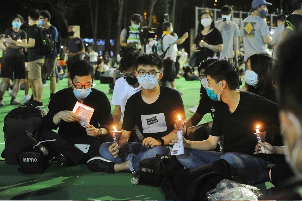 (L-R) Nathan Law, Joshua Wong, Sunny Cheung, Lester Shum, and others attended June 4, 2020, Tiananmen Square Vigil at Victoria Park in Hong Kong, despite the government banning the vigil. In May 2021, Wong was charged with inciting others to participate in an unauthorized assembly and sentenced to 10 months in prison. (Sung Pi-lung/The Epoch Times)