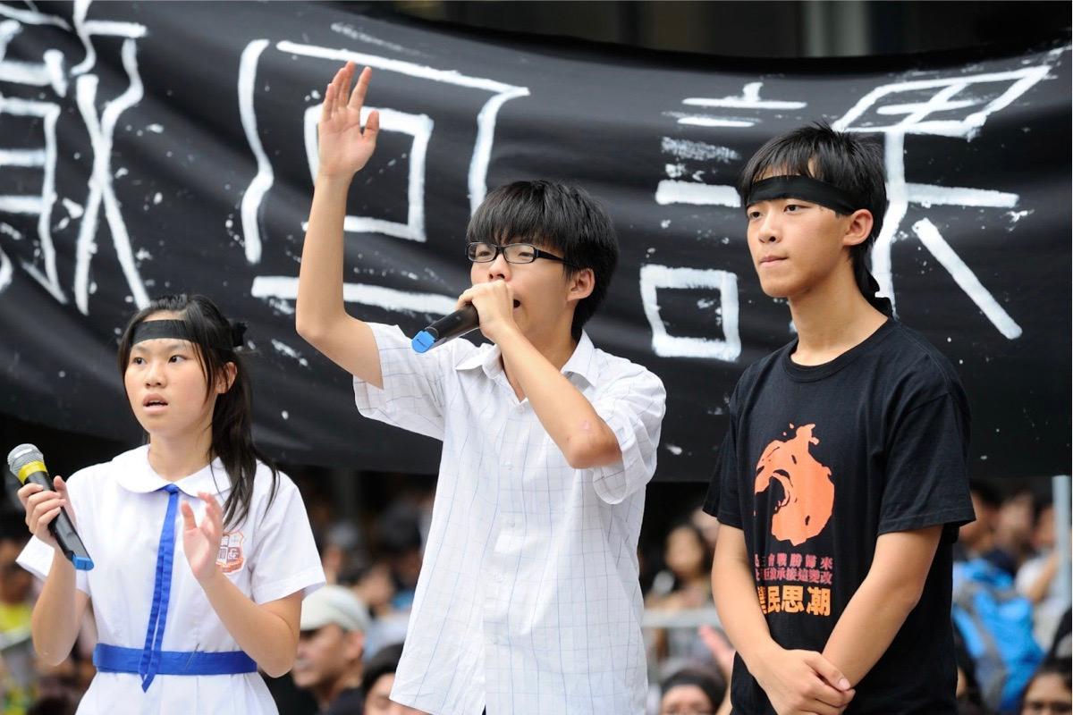 On Sept. 3, 2012, 15-year-old Joshua Wong led parents and students to demand the Hong Kong government withdraw the implementation of moral education and national education subject with a series of social movements. The movement included demonstrations, press conferences, and street stalls to educate the community about the government’s plan. (Sung Pi-Lung/The Epoch Times)