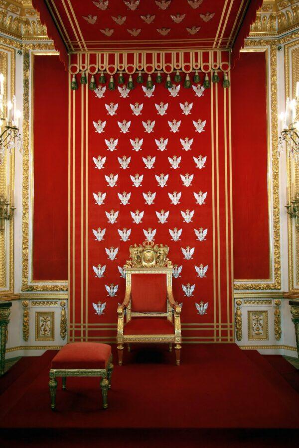French embroiderers from Camille Bernon Ltd. in Lyon made the silver decorative borders and silver eagles (the emblem of Poland) on the canopy of King Stanislaw II Augustus’s crimson throne. During World War II, the eagles disappeared, and only one surfaced years later in Canada. Embroiderers took three months to make each eagle on the reconstructed throne, using materials from the original French embroiderers. <span style="font-weight: 400;"> (</span><a href="https://www.shutterstock.com/g/tsz01"><span style="font-weight: 400;">Tomasz Szymanski</span></a><span style="font-weight: 400;">/</span><a style="font-size: 16px;" href="https://www.shutterstock.com/image-photo/interior-royal-castle-warsaw-residence-polish-9225772">Shutterstock)</a>
