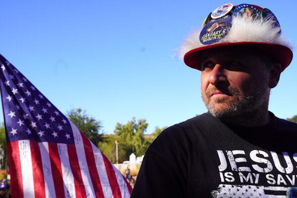 Wearing a hat festooned with Donald Trump buttons, Stephen Tenner of Arizona said he was disappointed by the low turnout at a sit-in demonstration in Phoenix on Nov. 25. (Allan Stein/The Epoch Times)