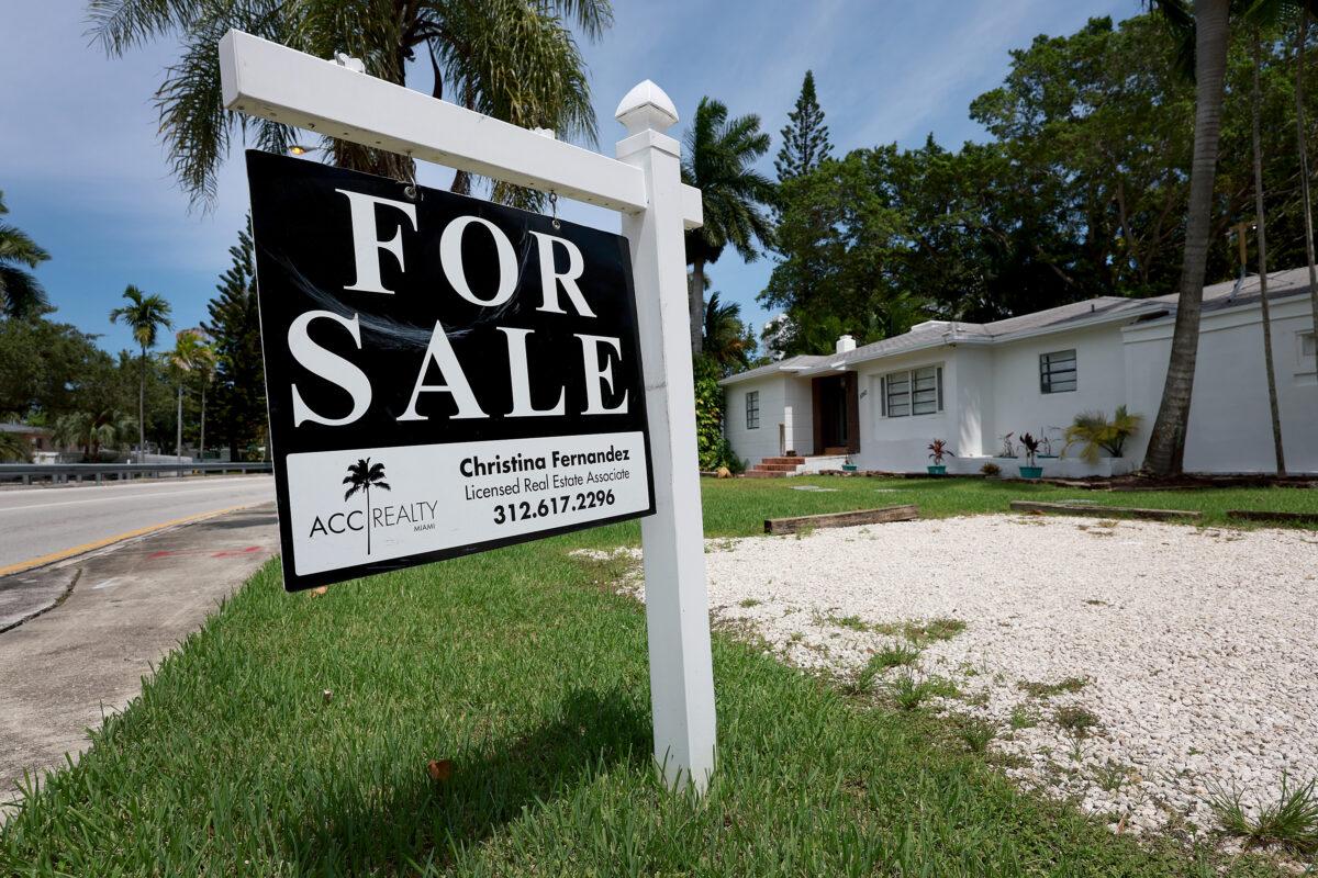 A "for sale" sign hangs in front of a home in Miami on June 21, 2022. (Joe Raedle/Getty Images)