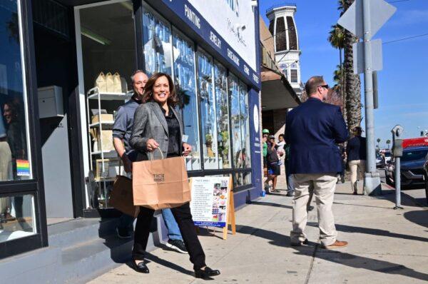 US Vice President Kamala Harris (2nd L), with Second Gentleman Doug Emhoff (L) leaves 'These Hands Collective,' after shopping during the observance of Small Business Saturday in Los Angeles on Nov. 26, 2022. (Frederic J. Brown/AFP via Getty Images)