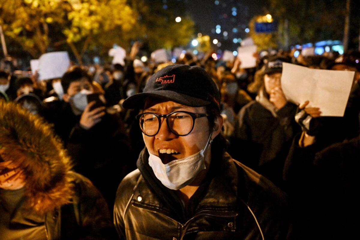 Protesters march against China's harsh COVID-19 restrictions in Beijing on Nov. 28, 2022. (Noel Celis/AFP via Getty Images)