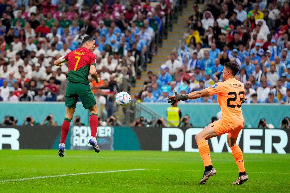 Portugal's Cristiano Ronaldo scores the opening goal during the World Cup group H soccer match between Portugal and Uruguay, at the Lusail Stadium in Lusail, Qatar, on Nov. 28, 2022. (Petr David Josek/AP Photo)
