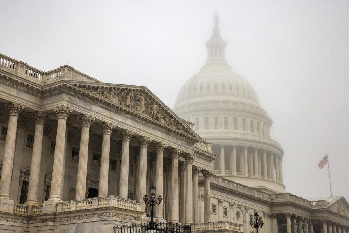 Early morning fog envelopes the U.S. Capitol dome behind the U.S. House of Representatives on Nov. 4, 2022. (Samuel Corum/Getty Images)