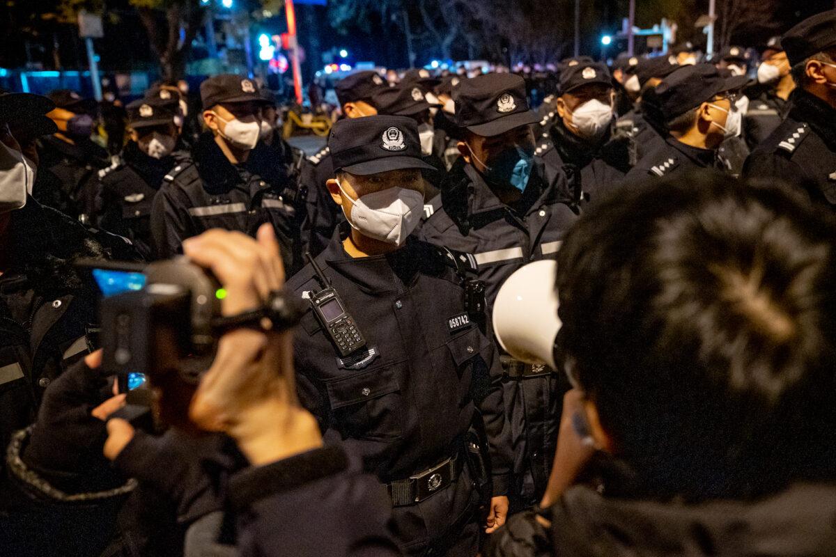 Police officers stand guard during a protest in Beijing on Nov. 28, 2022. (Bloomberg)