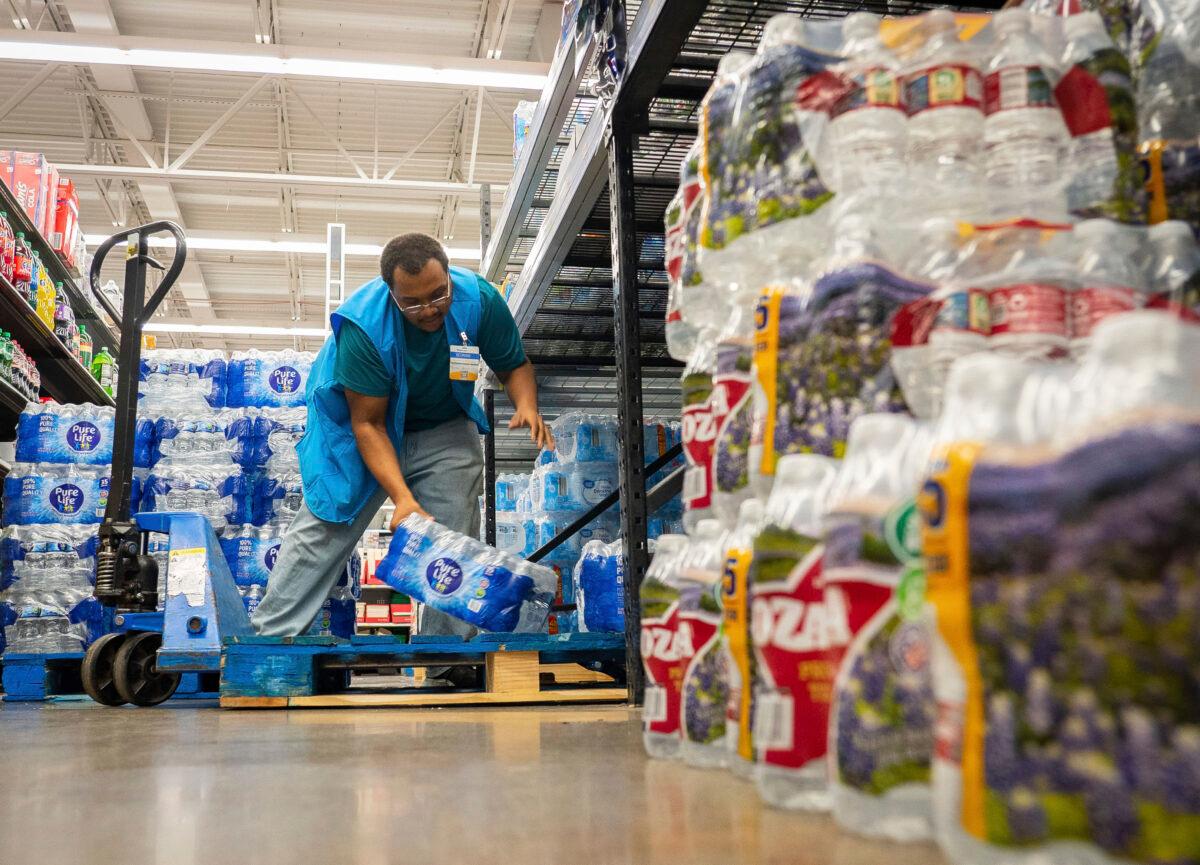Water is stocked at Walmart after a boil water notice was issued for the entire city of Houston at Walmart on S. Post Oak Road in Houston on Nov. 27, 2022. (Mark Mulligan/Houston Chronicle via AP)